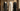 Three luxury abayas on gold mannequins showing work, casual, and formal styling options